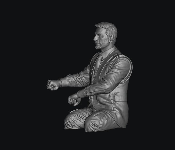 3D render of a grey resin male train driver figure, seated with legs cut, wearing a waistcoat and tie.