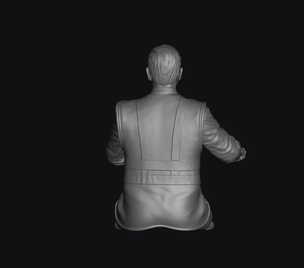 Grey 3D render of a seated male train driver figure with cut legs, shown from a rear view in a uniform jacket.