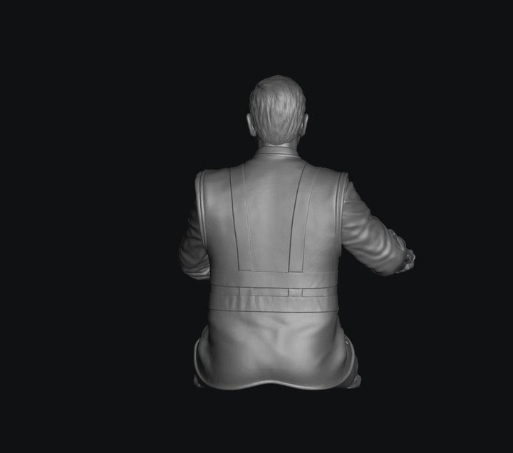 Grey 3D render of a seated male train driver figure with cut legs, shown from a rear view in a uniform jacket.