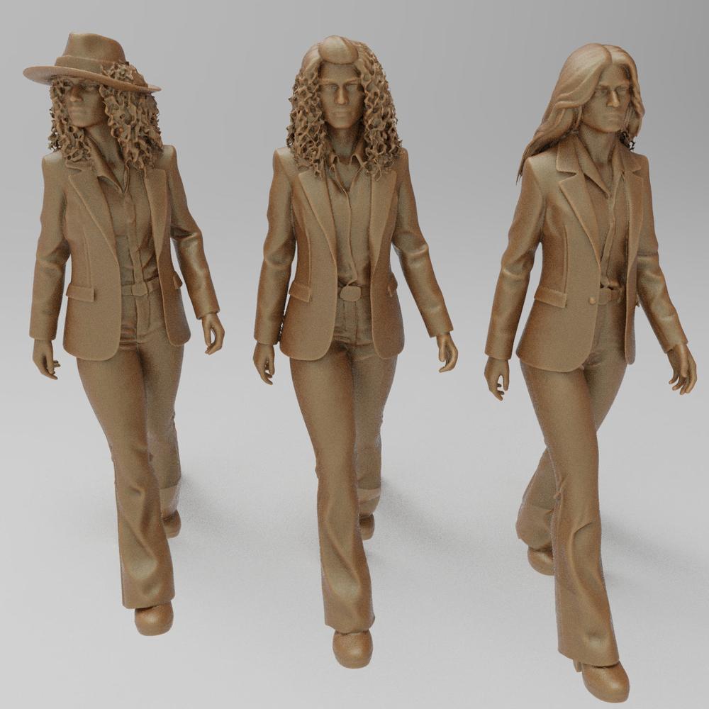 Three unpainted 3D-printed resin miniature figures of women in 1970s-style business suits and flared trousers.