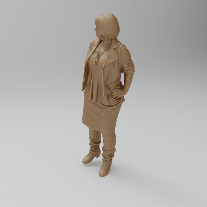 Unpainted 3D printed resin miniature of a woman in a jacket, skirt, and boots, standing in a neutral clay color.