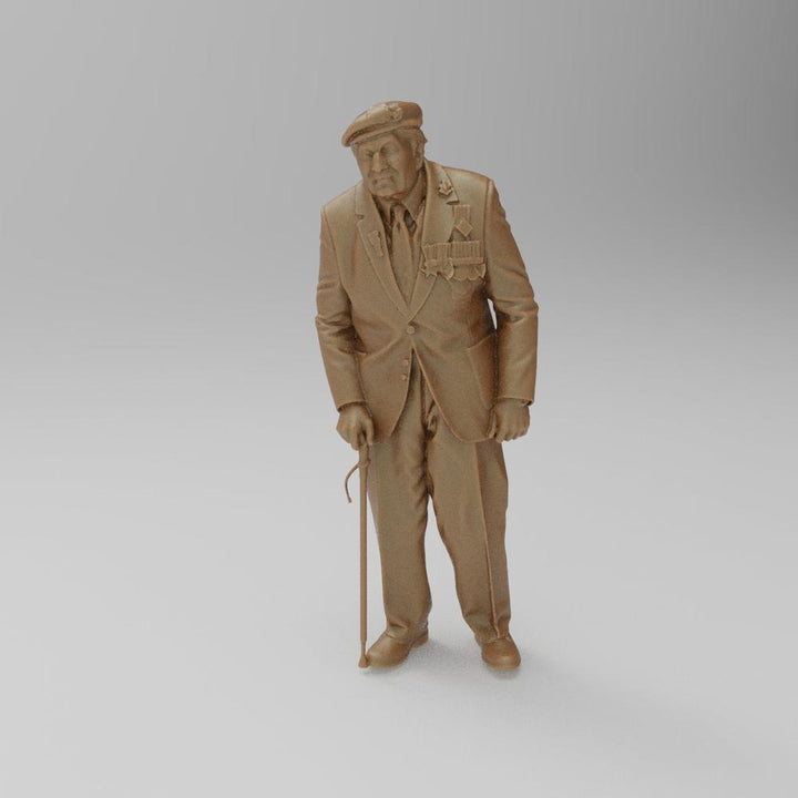 Unpainted 3D printed resin miniature of an elderly veteran wearing a beret and medals, standing with a walking stick.