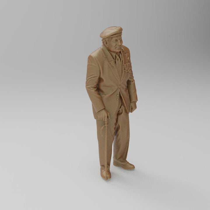 Unpainted terracotta resin 3D model of an elderly veteran wearing a beret and suit with medals, holding a walking stick.