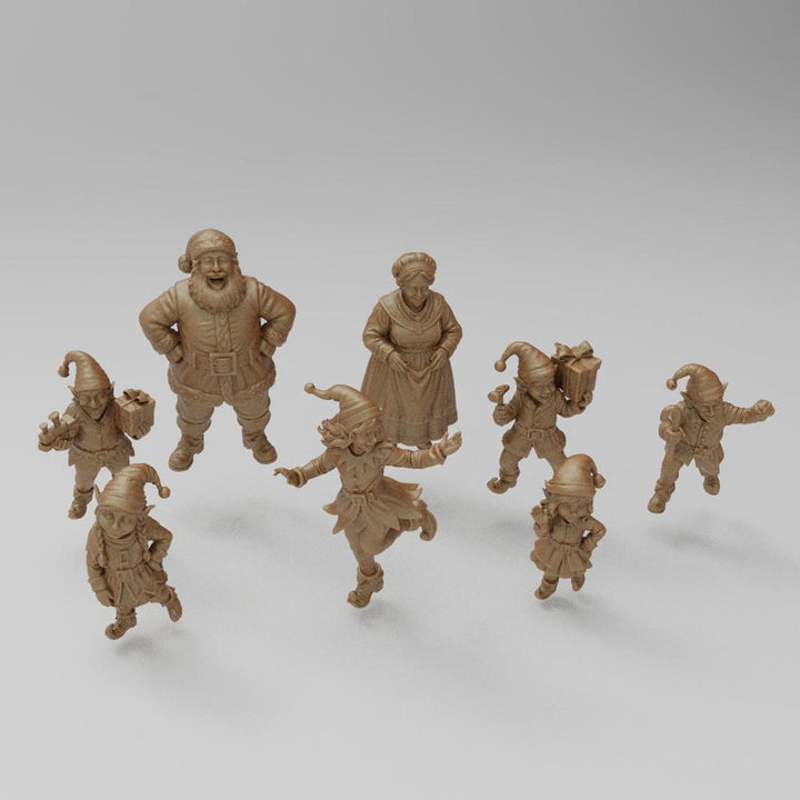 Unpainted 3D printed resin miniature set of Santa Claus, Mrs. Claus, and six festive elves for holiday dioramas.