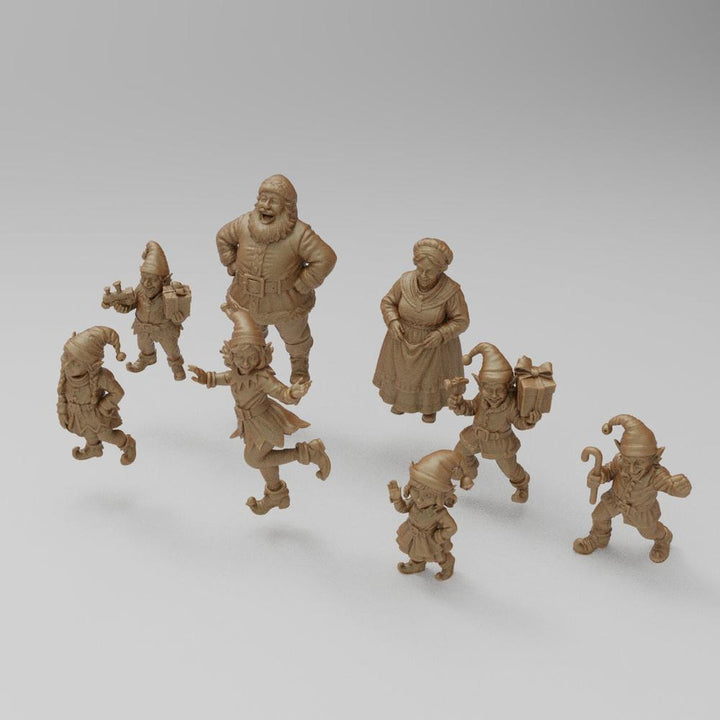 Unpainted 3D printed resin miniature set of Santa Claus, Mrs. Claus, and festive elves for dioramas and model railways.