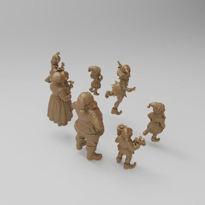 Unpainted terracotta-colored 3D resin miniature set featuring Santa Claus and his elves for diorama building.