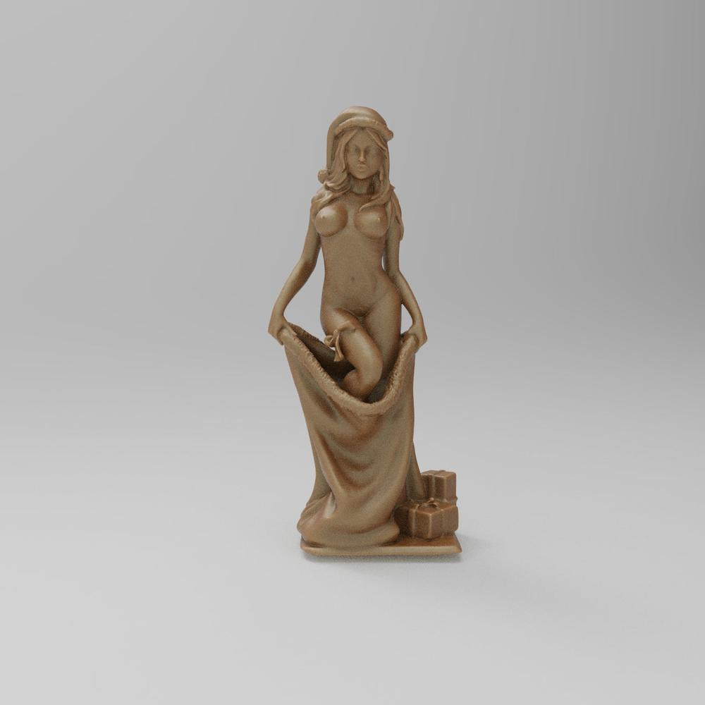 Unpainted terracotta resin miniature of a woman in a Santa hat holding a large sack with gift boxes at her feet.