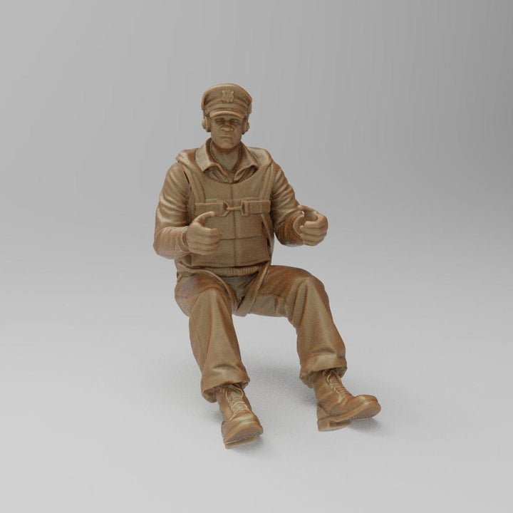 Unpainted 3D printed resin miniature of a seated WW2 bomber pilot in a terracotta clay finish for diorama modeling.