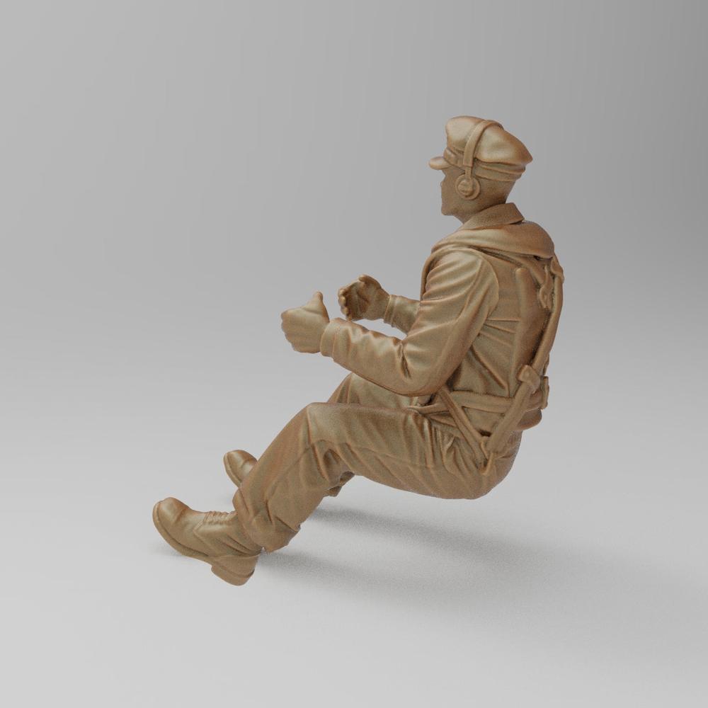 Unpainted terracotta resin 3D model of a seated WW2 bomber pilot wearing a flight cap and gear for diorama displays.