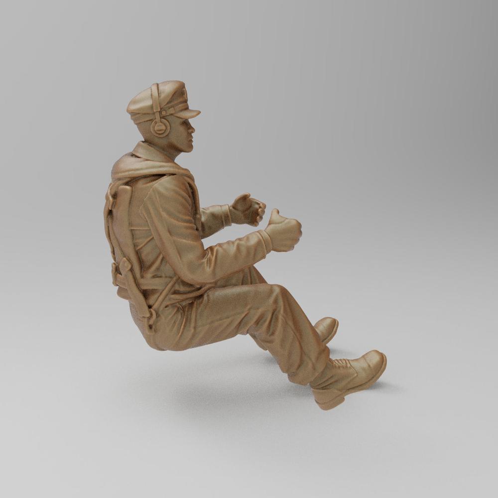 Unpainted terracotta-colored 3D resin model of a seated WW2 bomber pilot wearing a cap, headset, and flight gear.