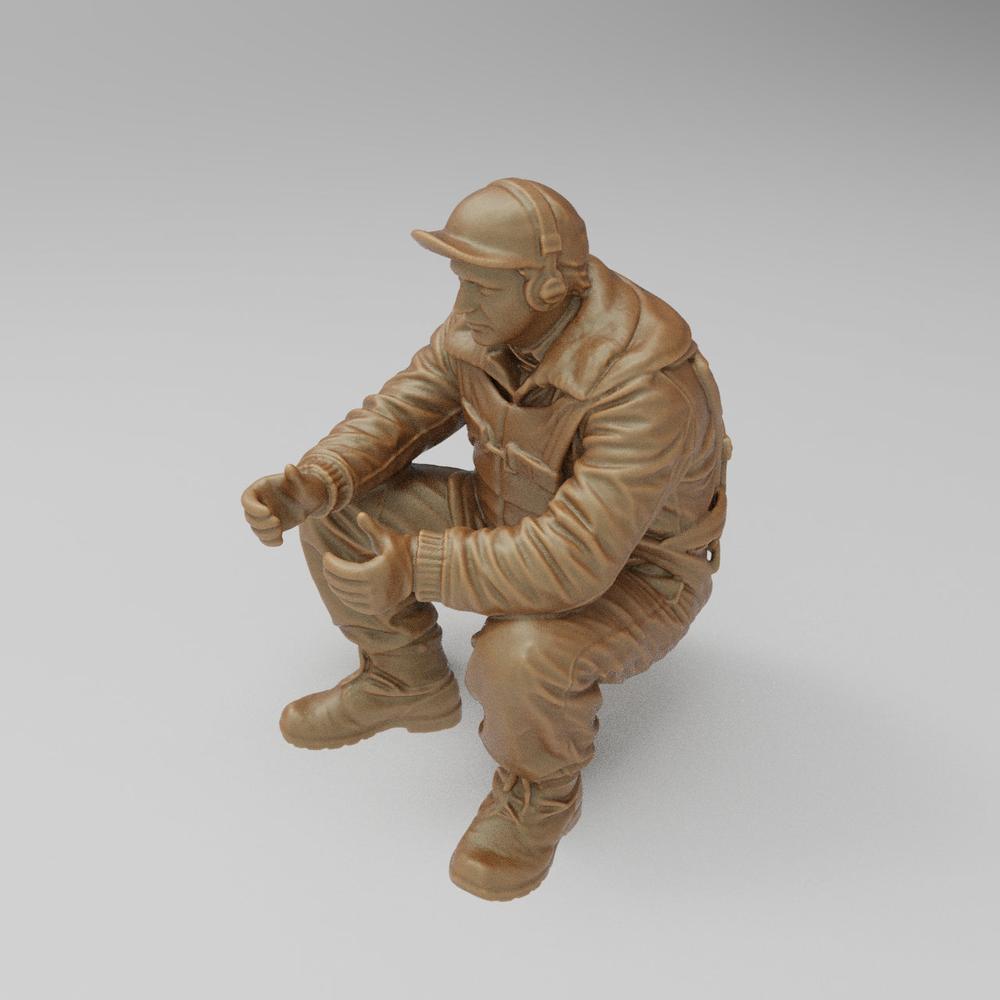 Unpainted 3D printed resin model of a WW2 US bomber tail gunner in a seated pose, featuring detailed flight gear.