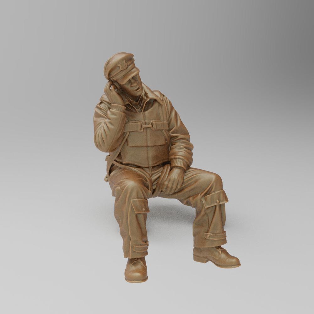 Unpainted terracotta resin 3D model of a seated WW2 bomber radio operator wearing a flight cap and uniform.