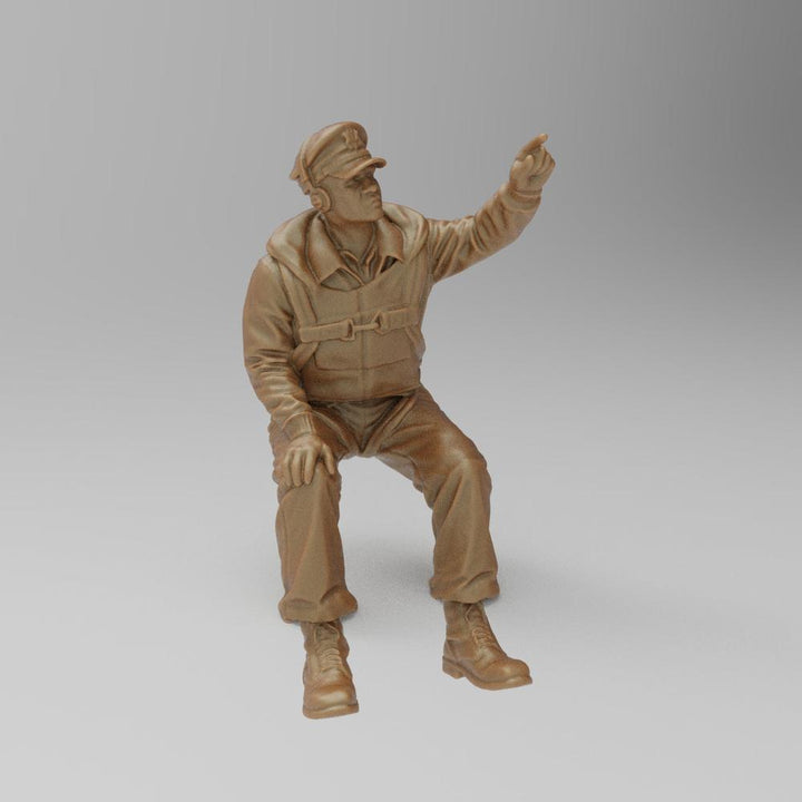 Unpainted terracotta-colored 3D printed model of a seated US WW2 bomber co-pilot pointing upward.