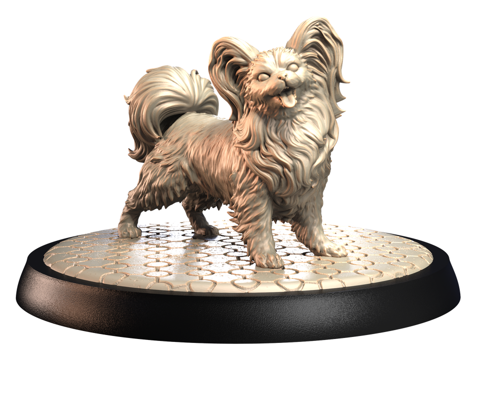 Unpainted 3D printed resin miniature of a Papillon dog standing on a textured circular cobblestone display base.