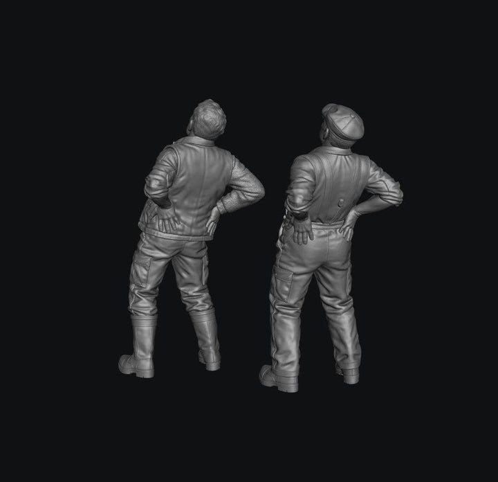 Two unpainted grey resin 3D-printed male farmer figures standing with hands on their lower backs in pain.