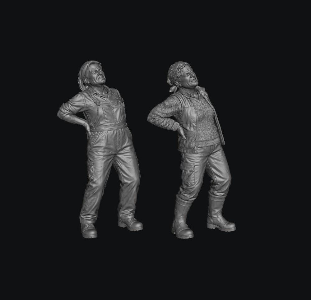 Two grey 3D-printed miniature figures of female farmers wearing work clothes and holding their aching backs.