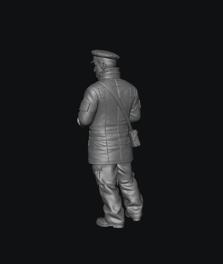 Unpainted 3D resin model of a male traffic warden in uniform, viewed from the back, for scale dioramas.