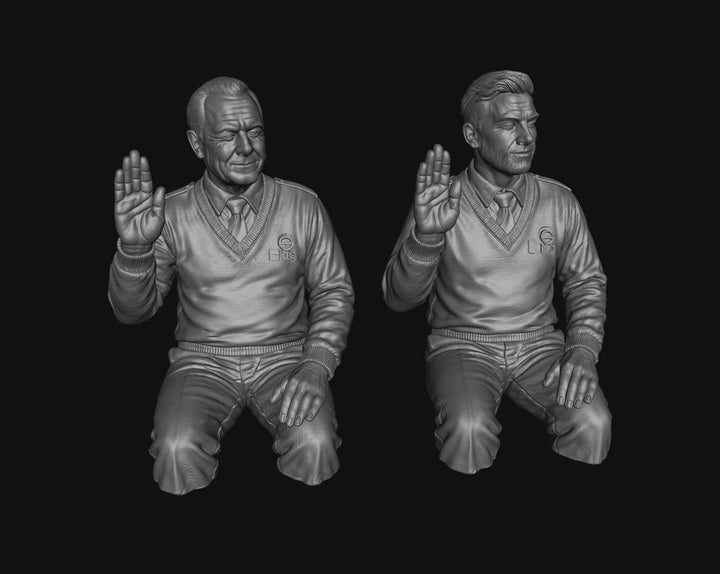 Two unpainted grey resin 3D-printed male bus driver figures in V-neck sweaters with hands raised in a greeting pose.