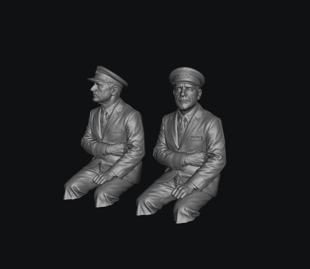 Two unpainted grey resin scale model train drivers wearing peaked caps and formal uniforms, shown in a 3D digital render.