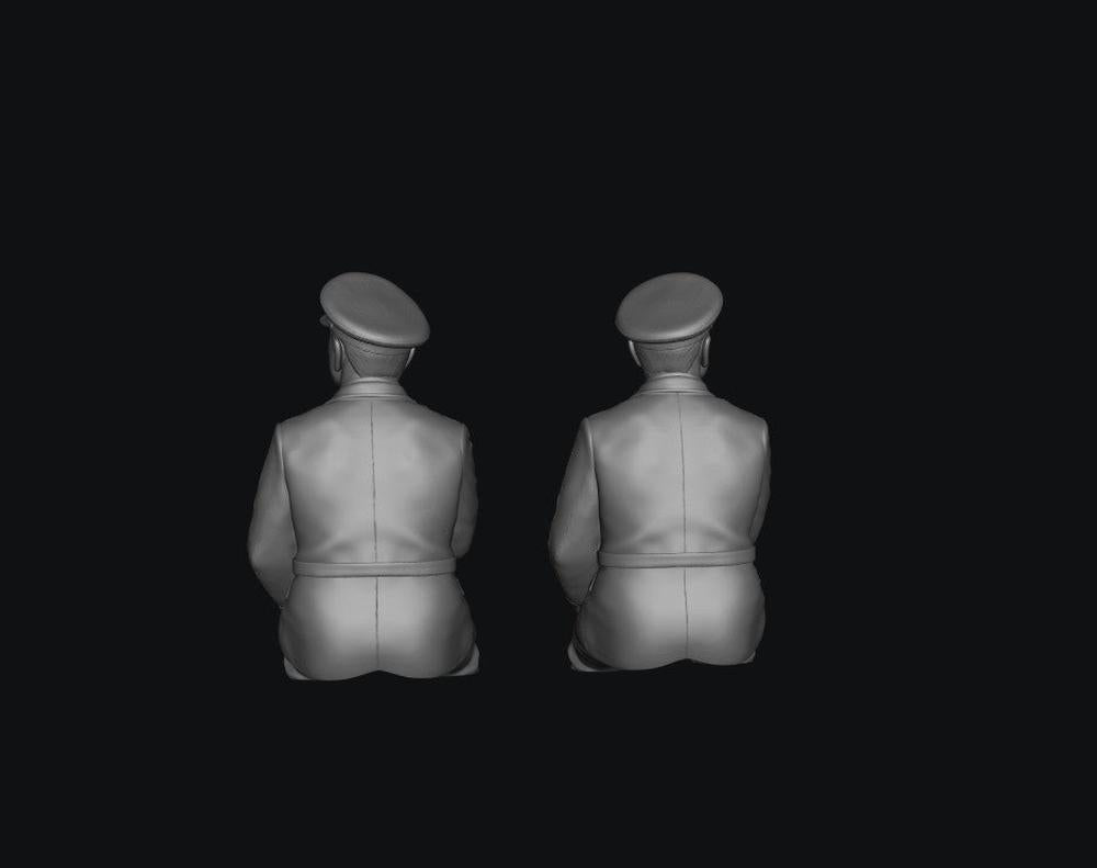 Two unpainted grey resin scale model train drivers wearing hats, viewed from behind, 3D render.