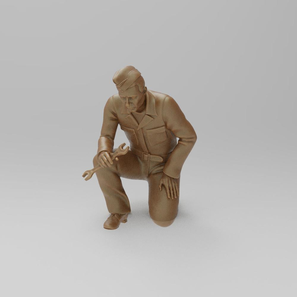 Unpainted terracotta resin 3D model of a kneeling WW2 RAF ground mechanic holding a wrench.