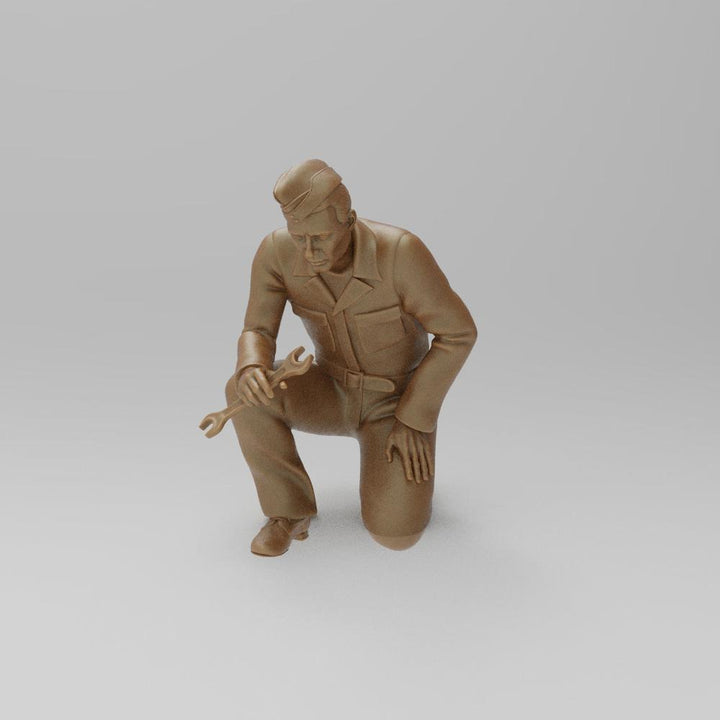 Unpainted terracotta resin 3D model of a kneeling WW2 RAF ground mechanic holding a wrench.