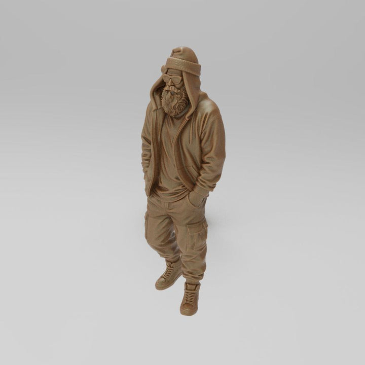 Unpainted 3D printed resin miniature of a cool Santa wearing a hoodie, beanie, glasses, and cargo pants.