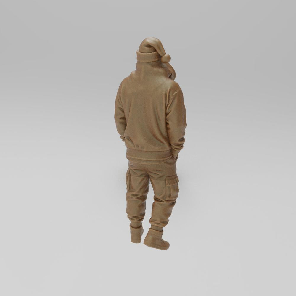 Unpainted terracotta resin 3D model of a cool Santa wearing a hoodie, cargo pants, and a beanie, seen from behind.