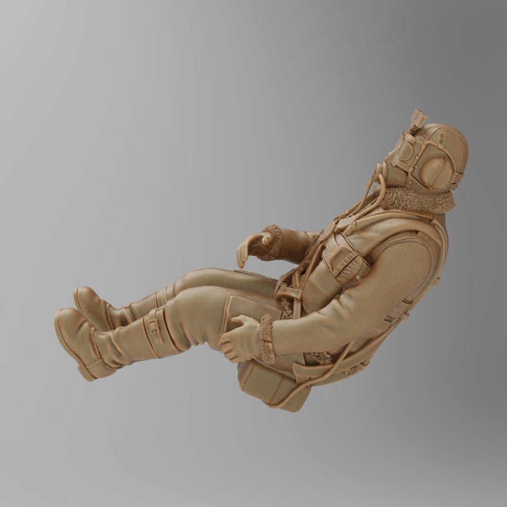 Unpainted 3D-printed terracotta resin miniature of a seated WW2 RAF pilot in flight gear, side profile view.