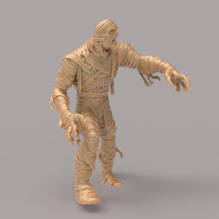 Unpainted terracotta-colored 3D printed resin miniature of a mummy in a reaching pose for dioramas and wargaming.