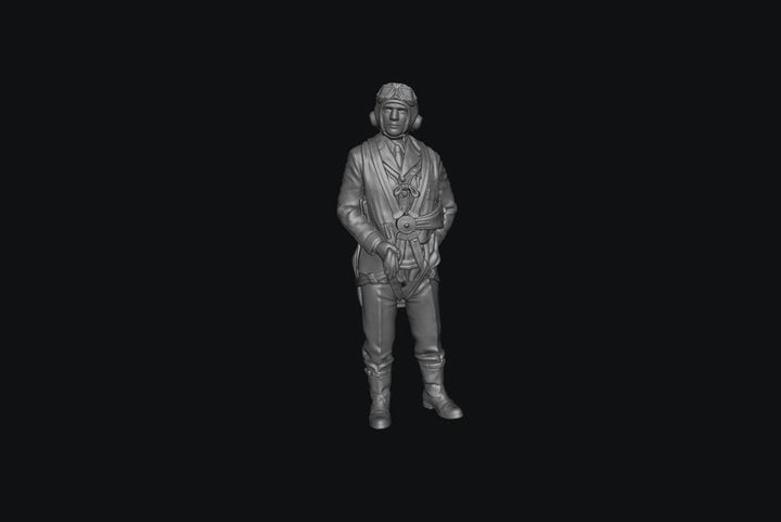 Unpainted grey resin 3D printed model of a WW2 RAF fighter pilot in uniform with flight gear and goggles.