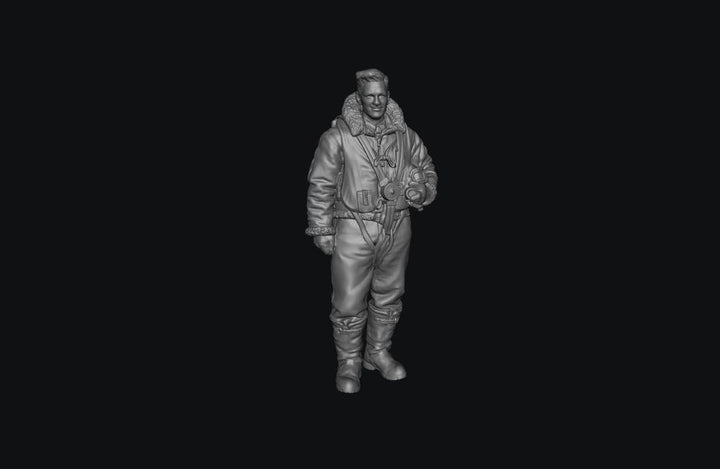 Unpainted grey 3D printed miniature of a WW2 RAF bomber crew member in flight gear, standing and holding a helmet.