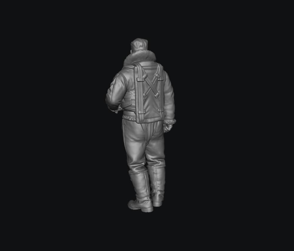 Unpainted grey 3D printed resin miniature of a WW2 RAF bomber crew member in flight gear, viewed from behind.