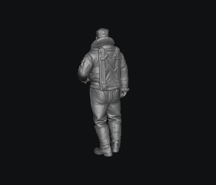 Unpainted grey 3D printed resin miniature of a WW2 RAF bomber crew member in flight gear, viewed from behind.
