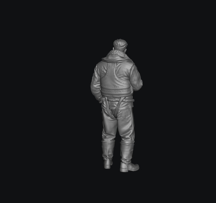 Unpainted grey 3D printed miniature of a WW2 RAF bomber crew member in flight gear, viewed from behind.