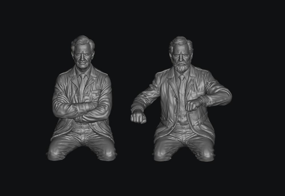 Two unpainted grey resin 3D-printed figures of early British Rail train crew members in jackets.
