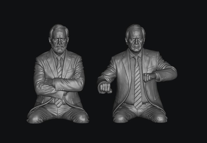 Two unpainted grey 3D-printed resin scale model figures of late BR train crew members in suits.