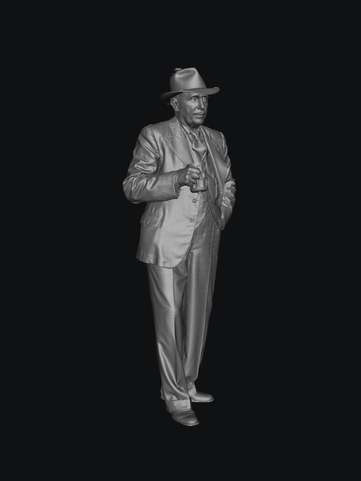 3D render of a 1940s man in a suit and fedora holding a beer mug, grey unpainted scale model figure.