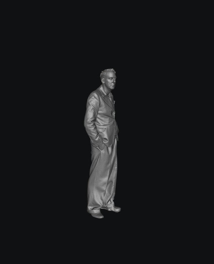 Grey 3D render of a 1940s-style man in a suit standing with hands in pockets for scale model dioramas.