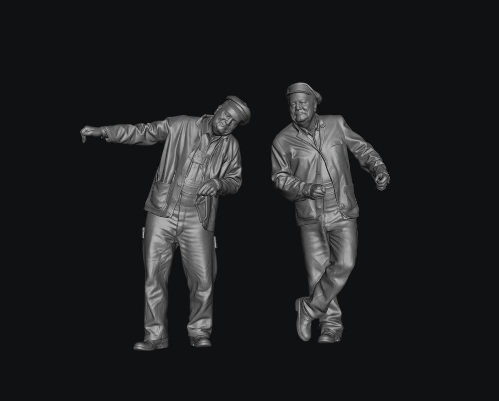 Two unpainted grey 3D-printed resin scale model figures of steam and diesel train engine drivers in caps.