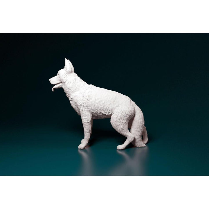 Unpainted 3D printed resin model of a standing German Shepherd with detailed fur texture on a dark background.