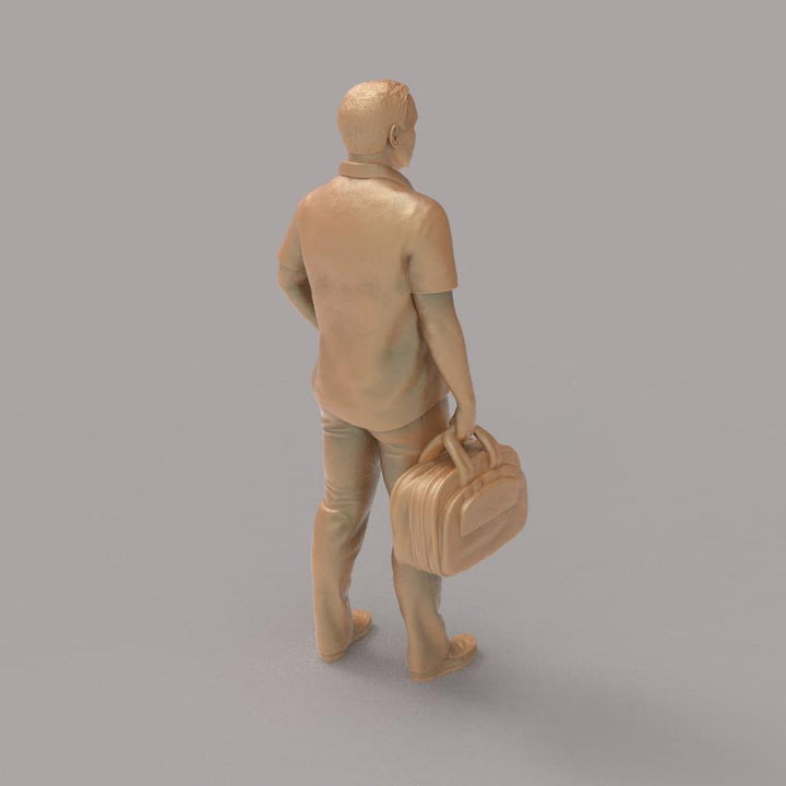 MM2094 Man With Bag waiting for a Train Figure