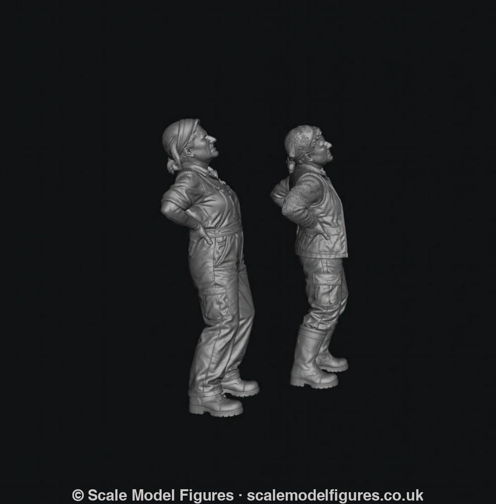 Two unpainted grey resin 3D-printed miniature figures of female farmers standing with hands on their aching backs.