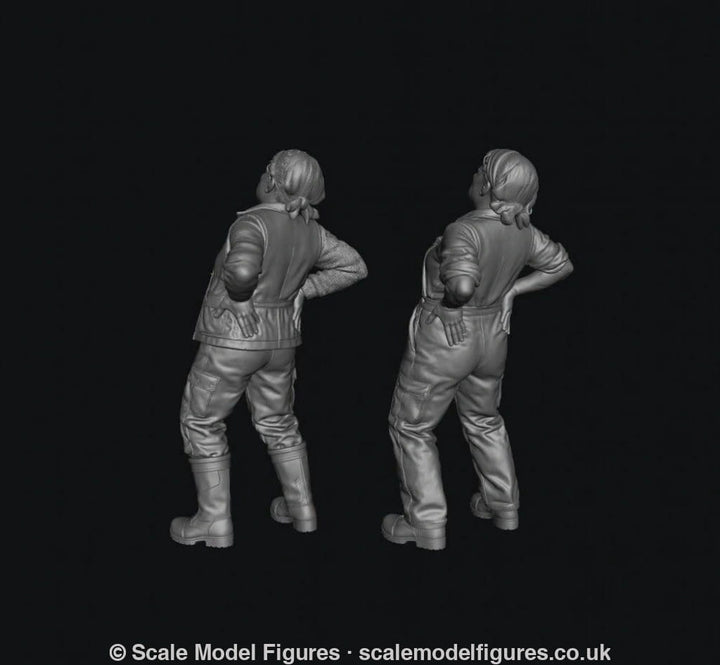Two grey 3D-rendered scale model figures of a female farmer with a bad back, wearing work clothes and boots.