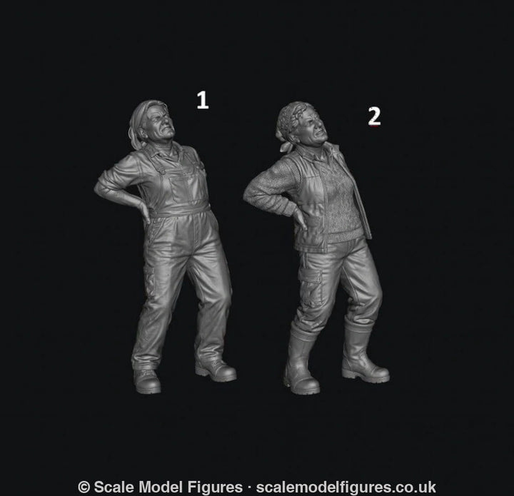 Two unpainted grey 3D resin model figures of a female farmer holding her back in pain, wearing overalls or vest.