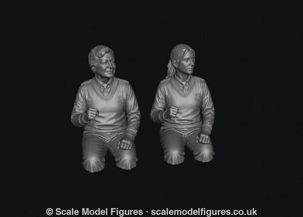 Two unpainted grey resin 3D-printed female bus driver figures in uniform, shown from the waist up in a seated pose.