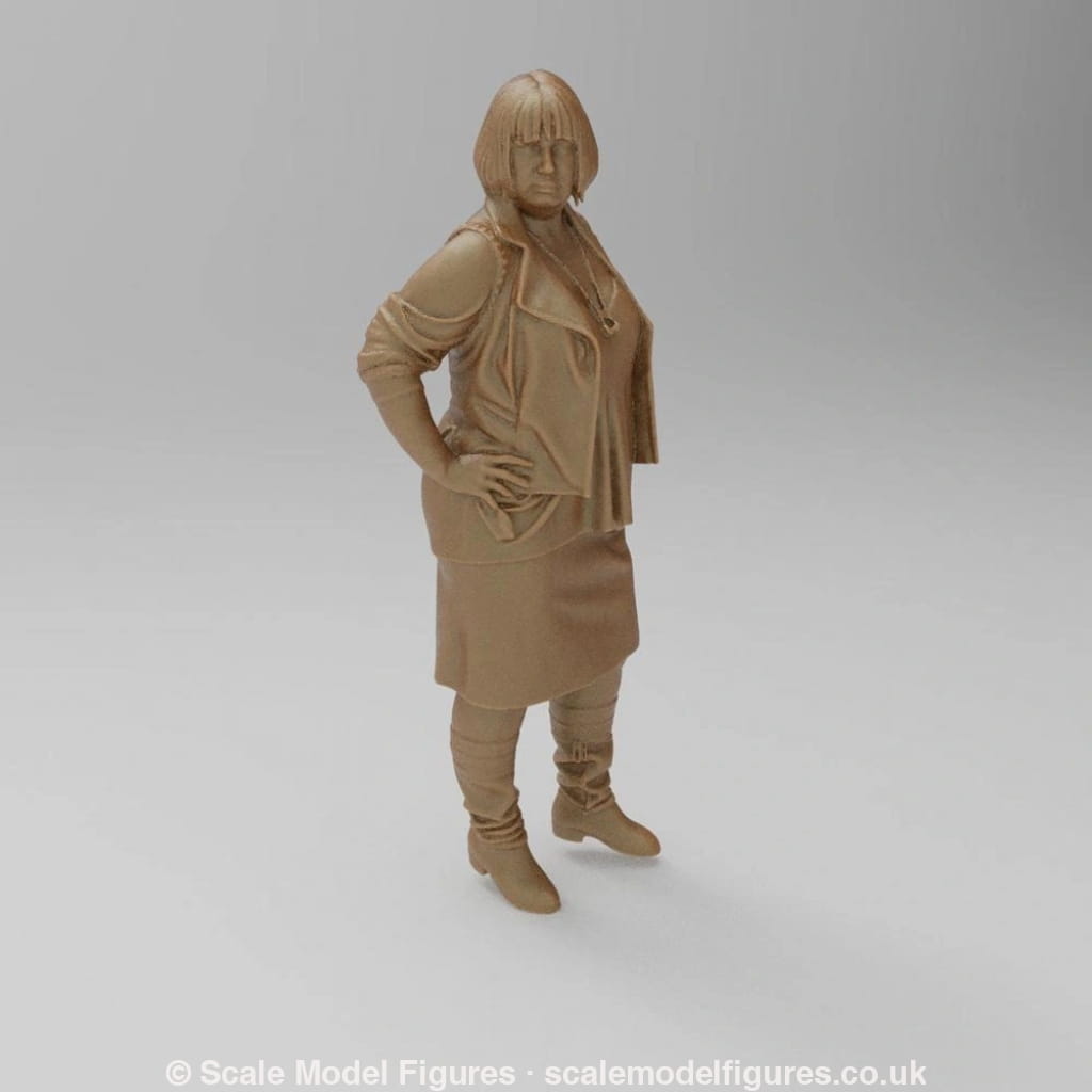 Unpainted terracotta-colored 3D resin model of a woman in a jacket, skirt, and boots for dioramas and model railways.